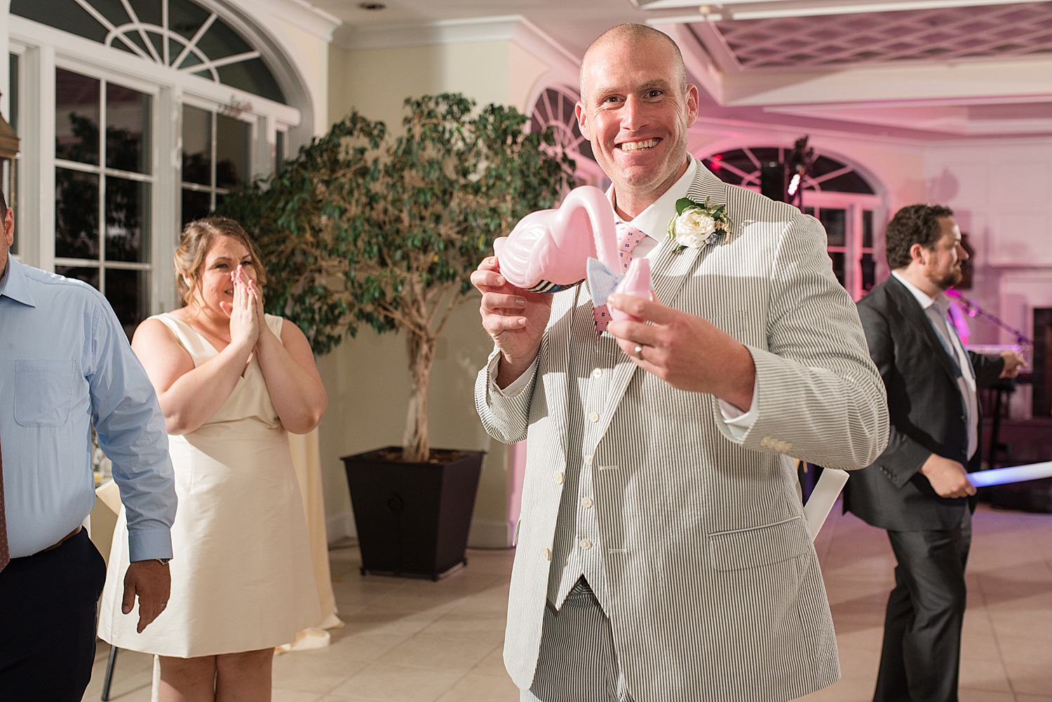 groom with flamingo