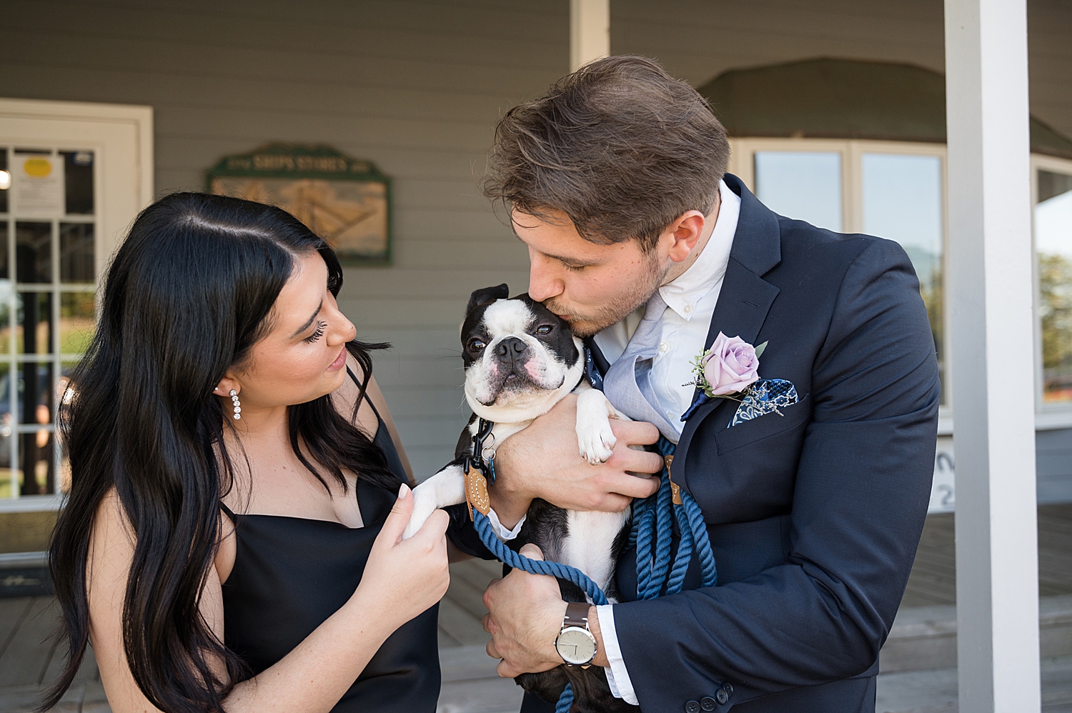 guests kiss on couple's dog