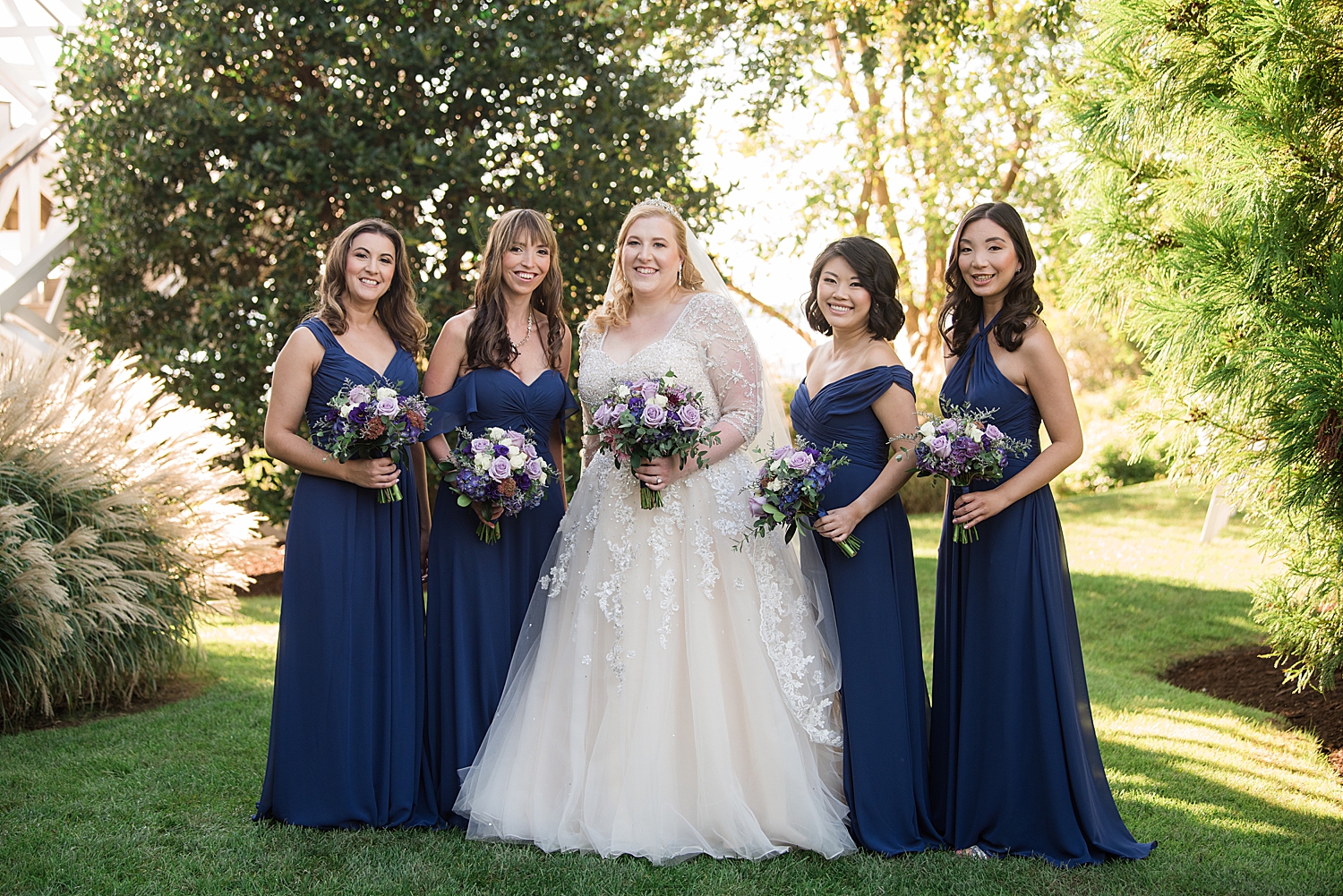 bride with bridesmaids in navy