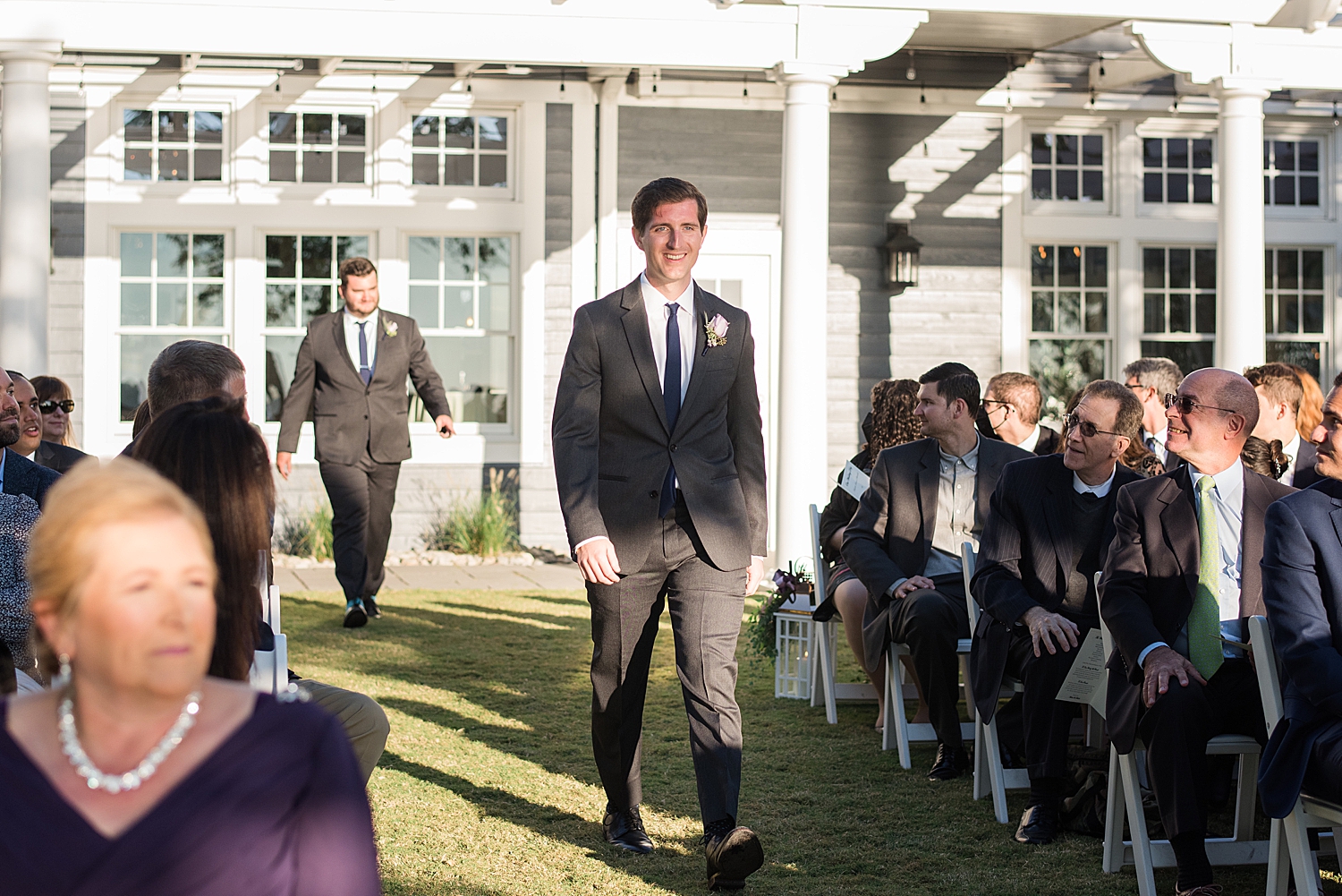 groom walks down aisle