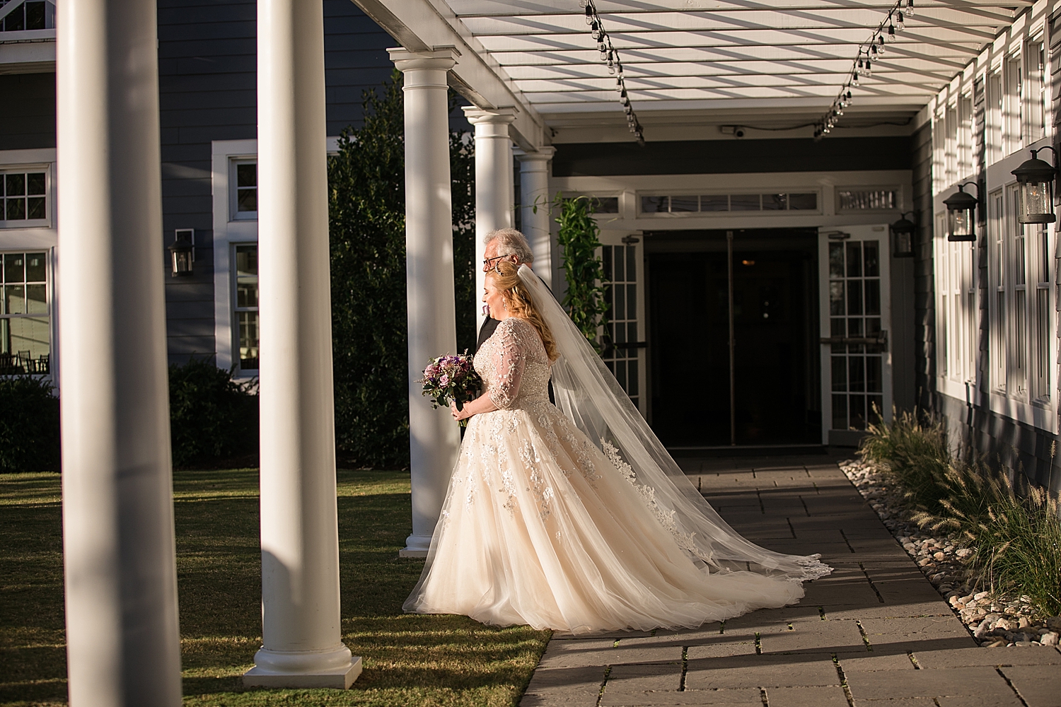 bride walks down the aisle with dad