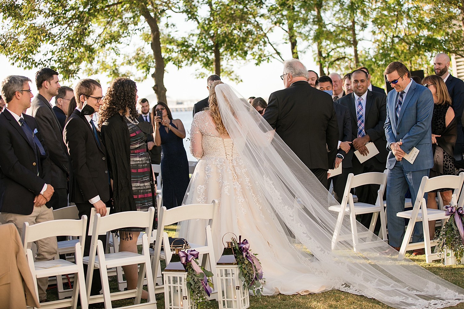 bride walks down the aisle with dad