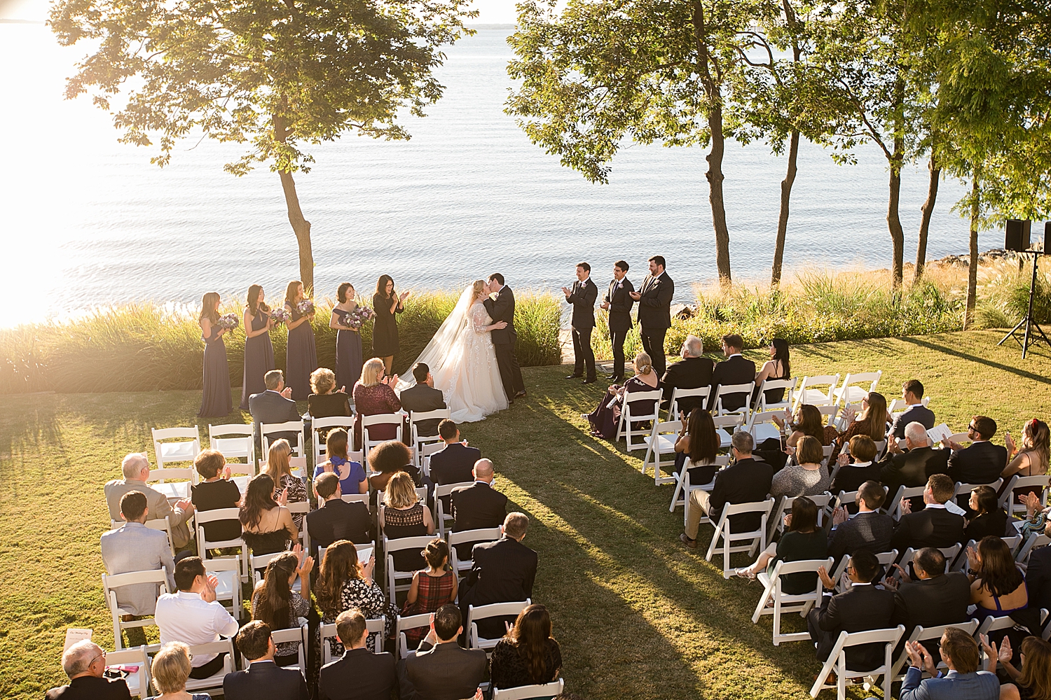 wide shot of first kiss during ceremony overlooking chesapeake bay