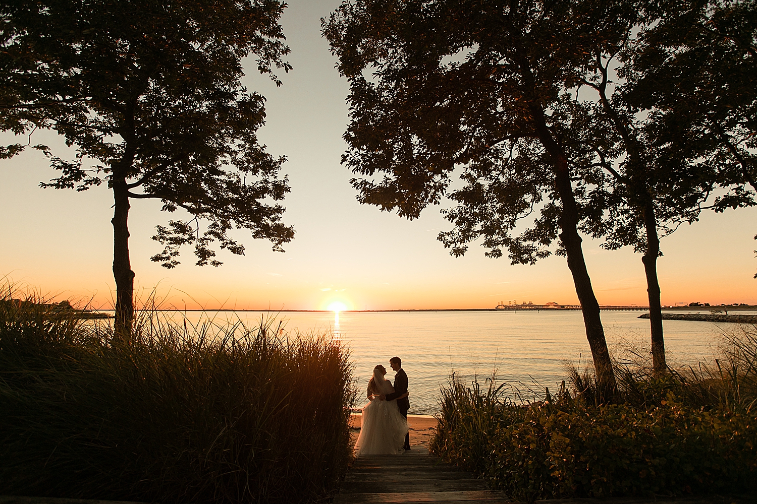 bride and groom portrait on beach at sunset