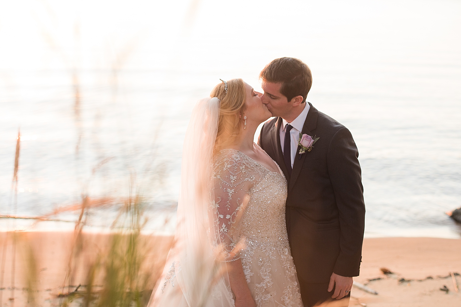 bride and groom portrait on beach at sunset