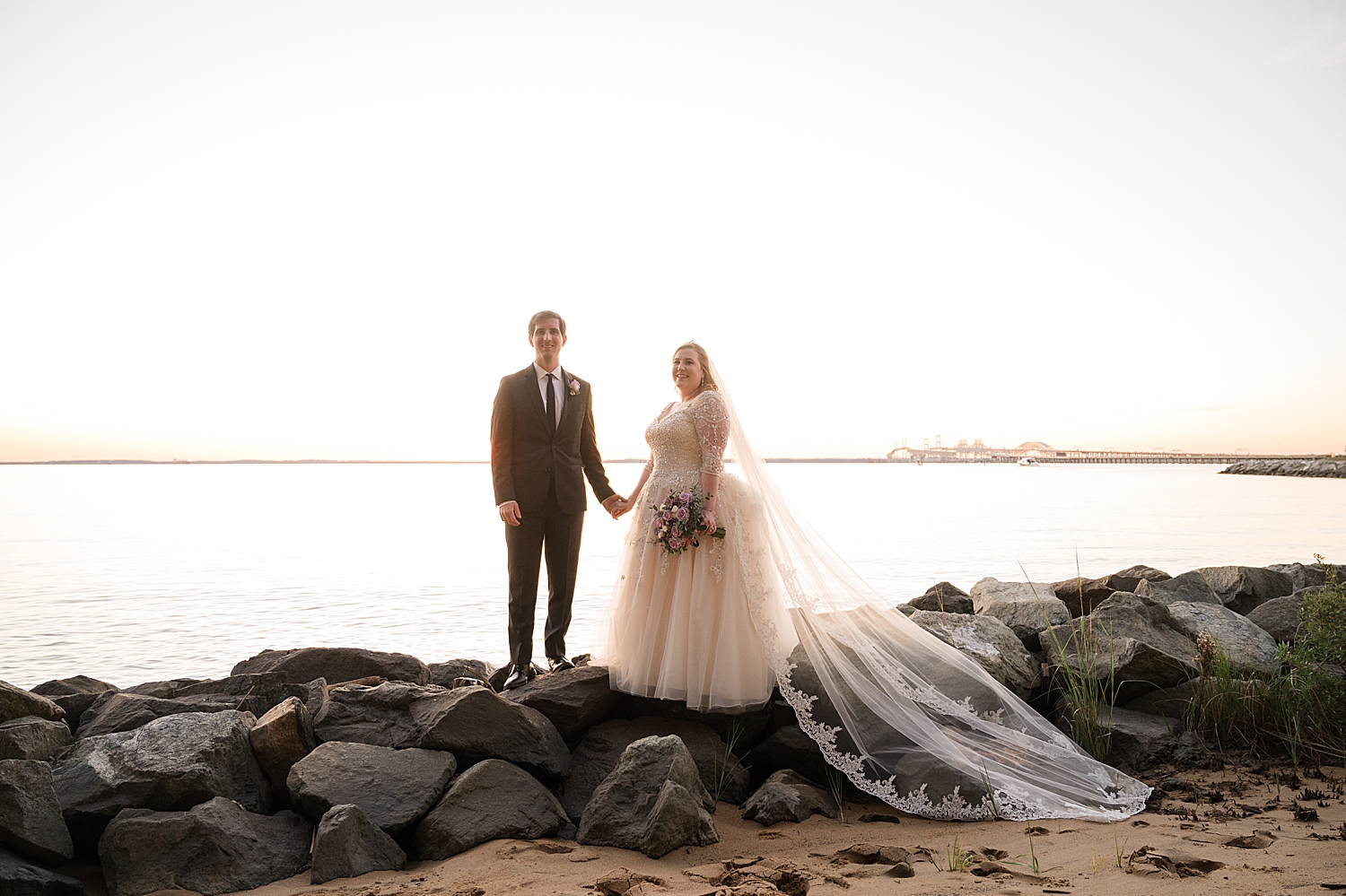 bride and groom portrait on beach at sunset