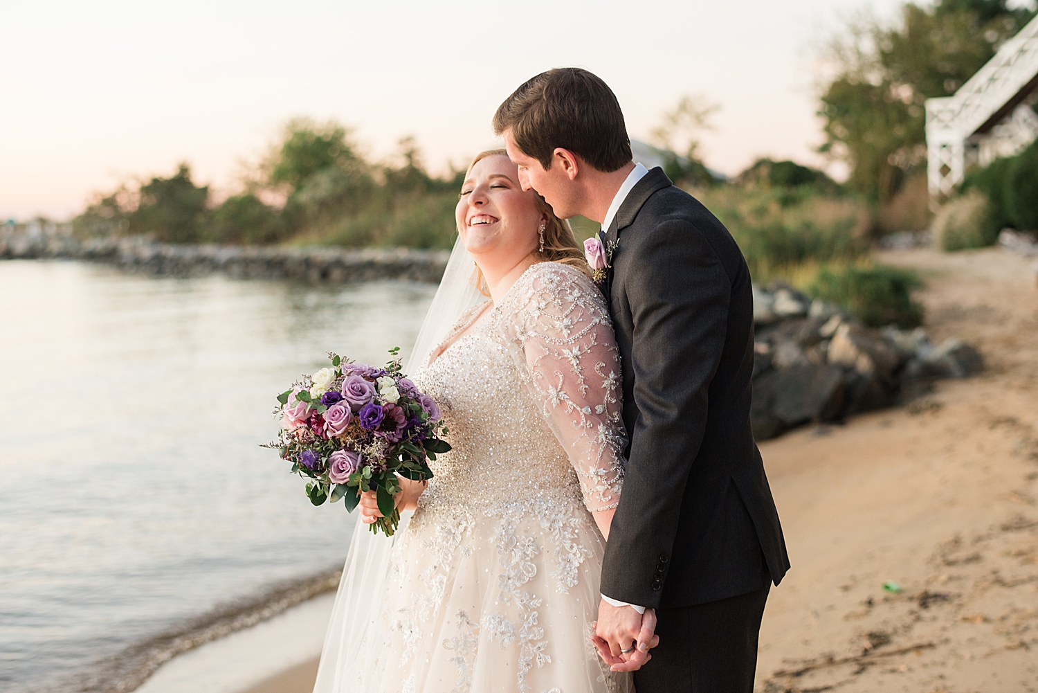 bride and groom portrait on beach at sunset