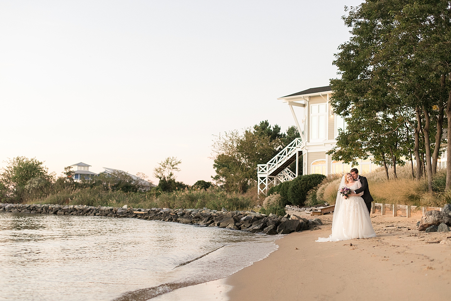 bride and groom portrait on beach at sunset