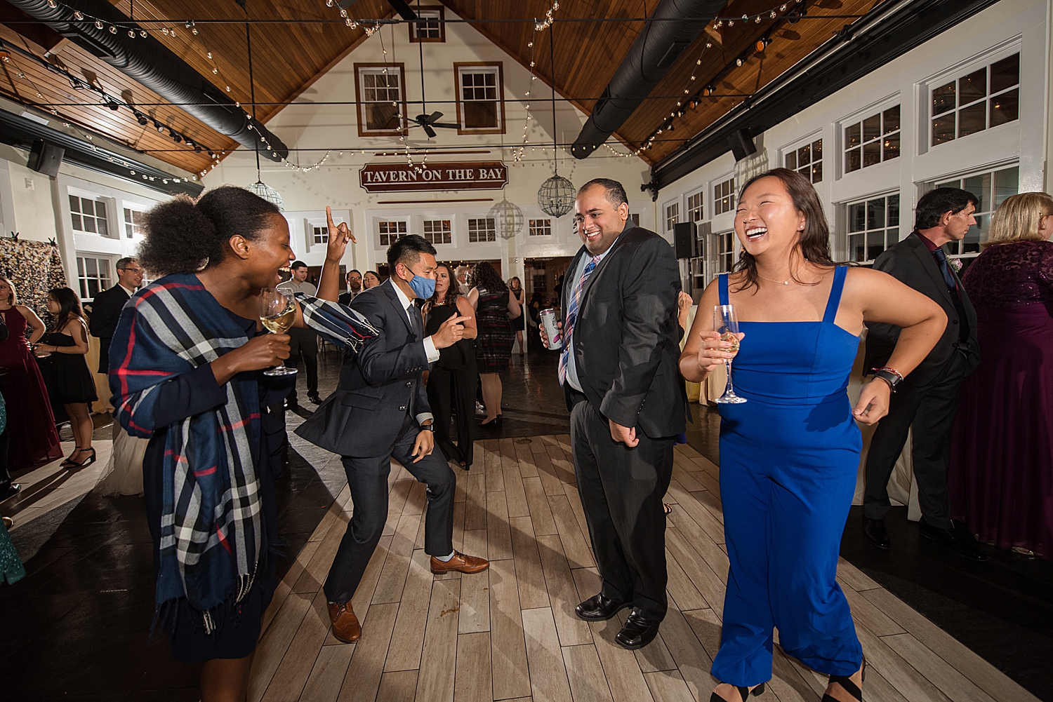 candid wedding guests dancing