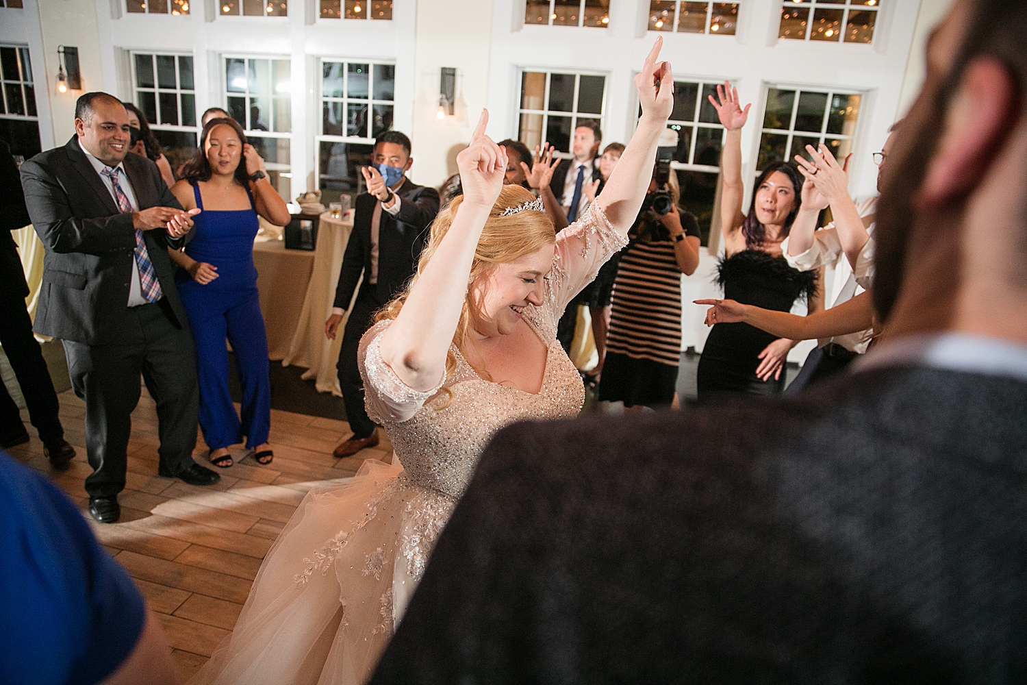 candid wedding guests dancing