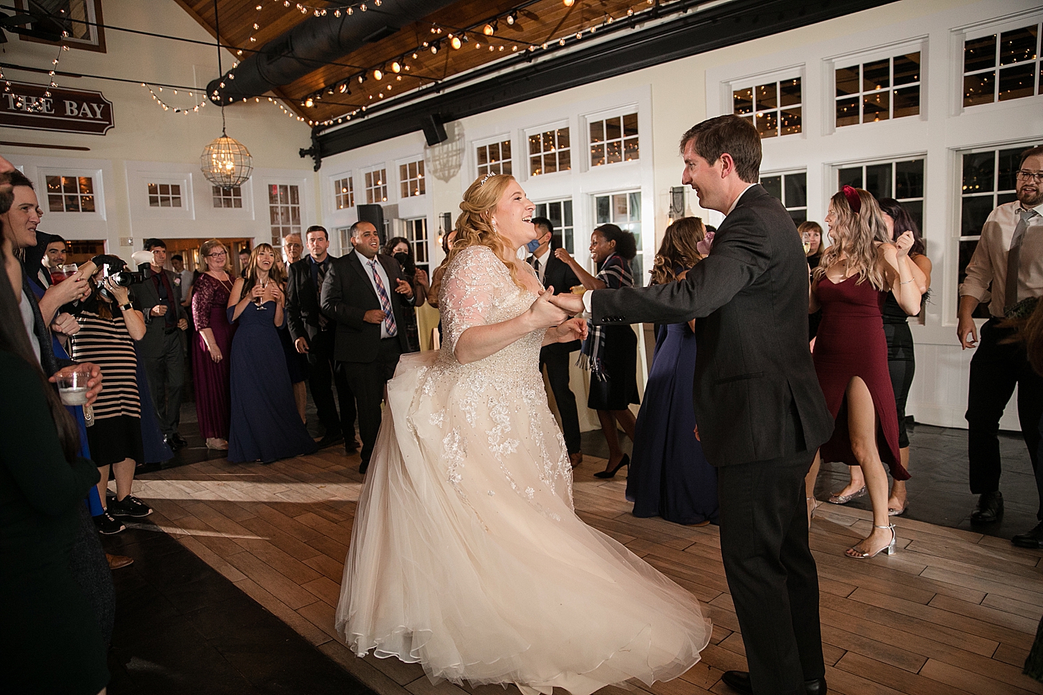 candid bride and groom dancing