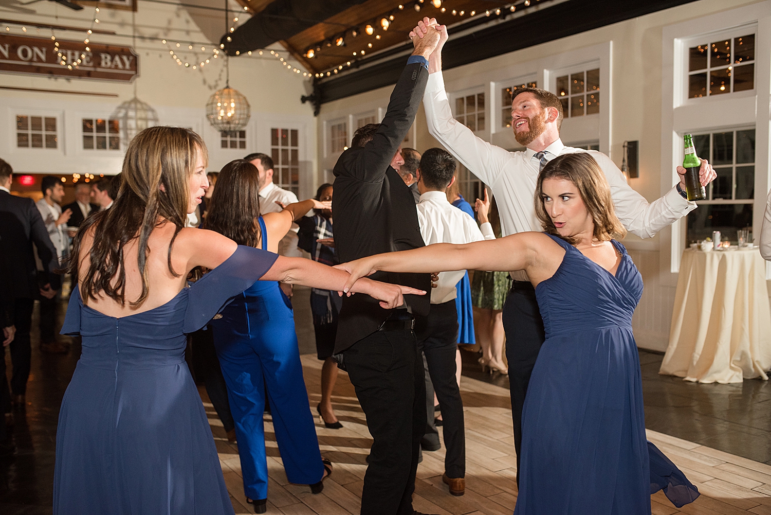 candid wedding guests dancing