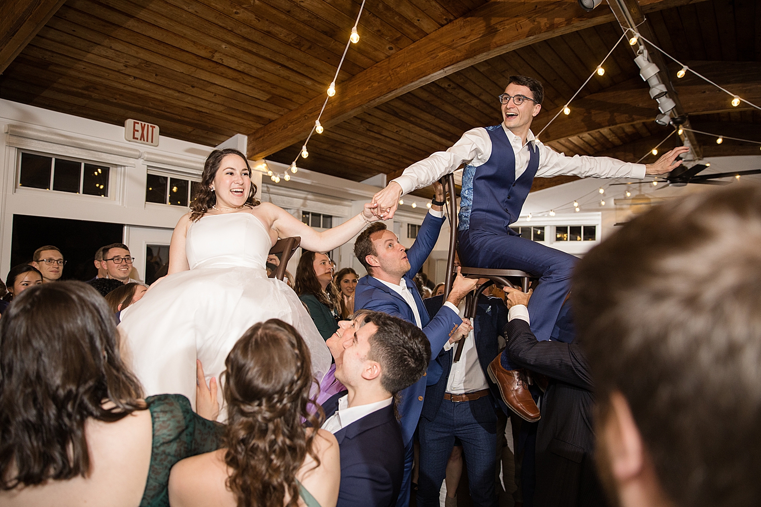 bride and groom lifted during horah