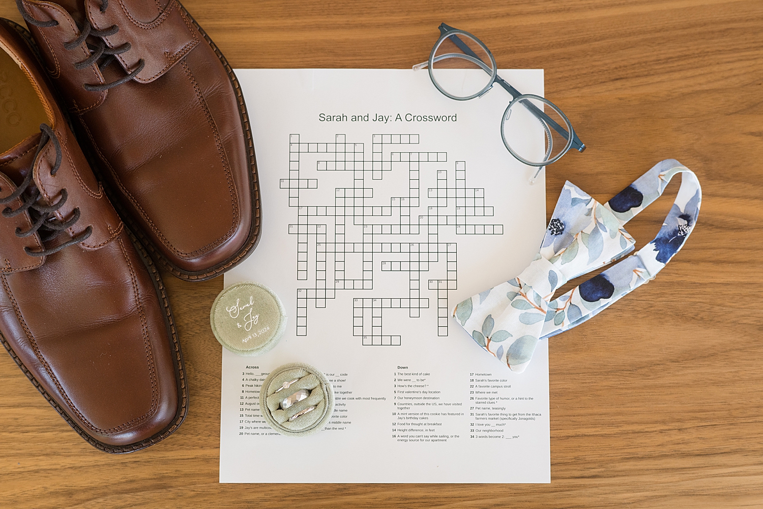 groom flat lay with custom crossword puzzle