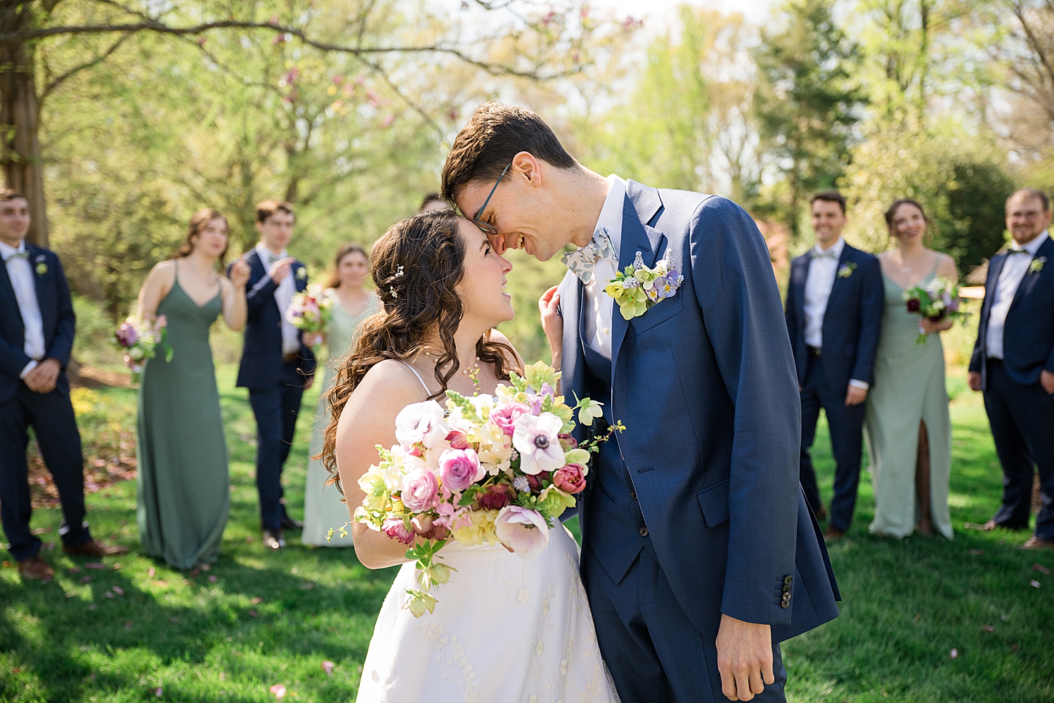 bride and groom rest foreheads together