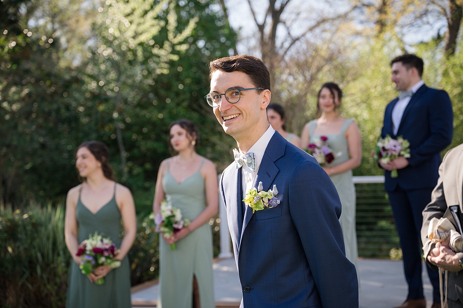 groom waiting for bride at the end of the aisle