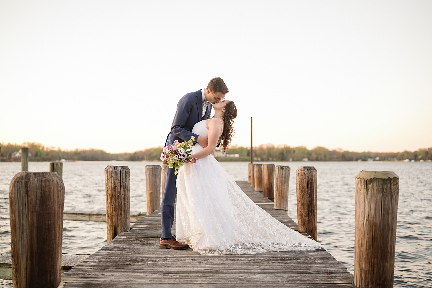 couple portrait on pier at historic london town and gardens