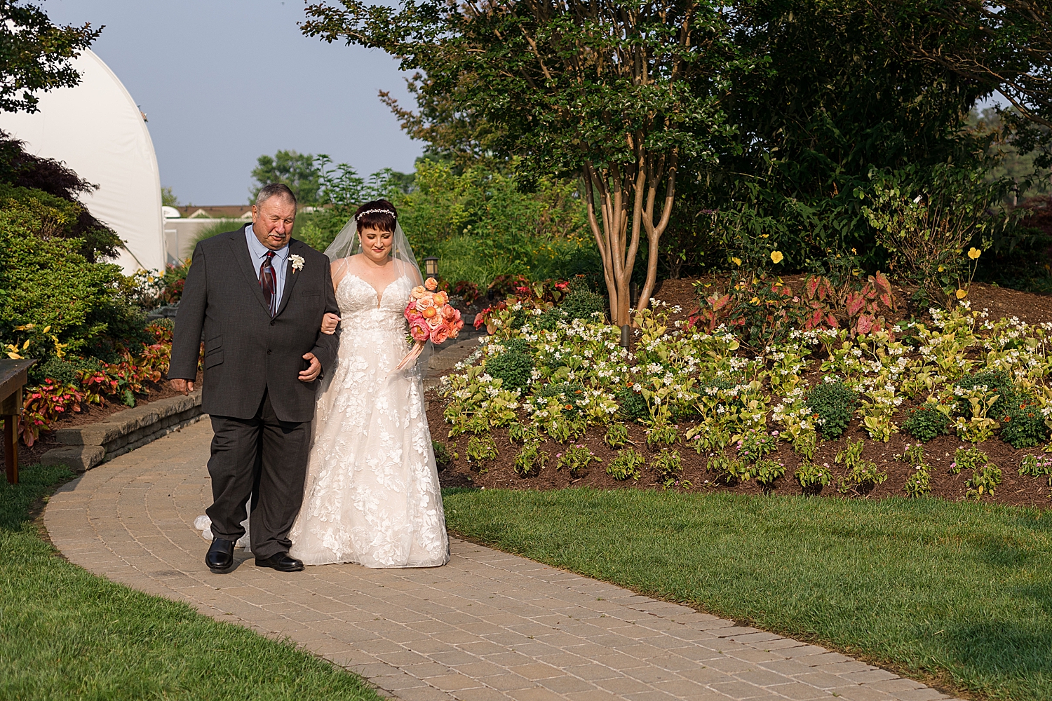 bride entering ceremony with dad