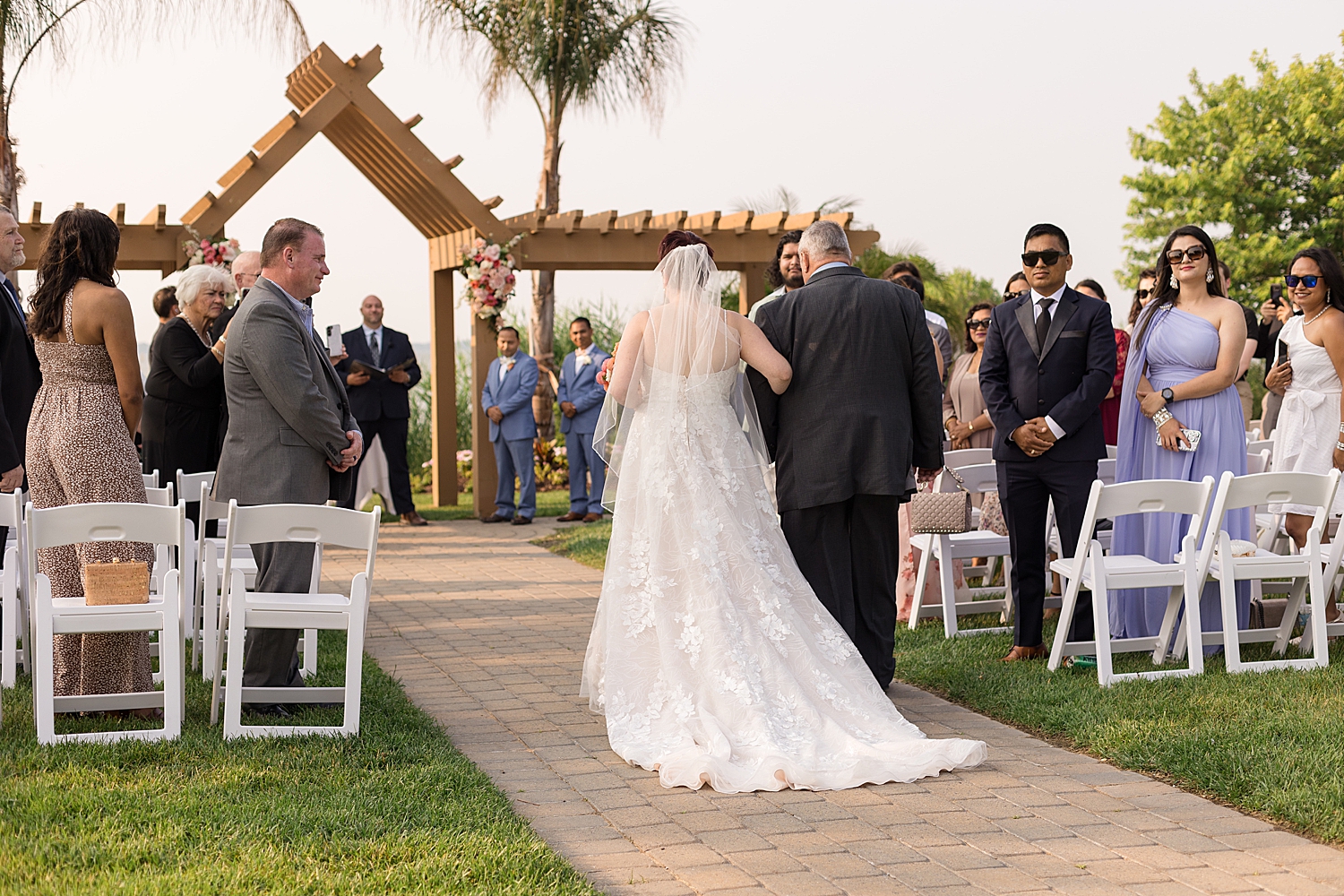 bride entering ceremony with dad