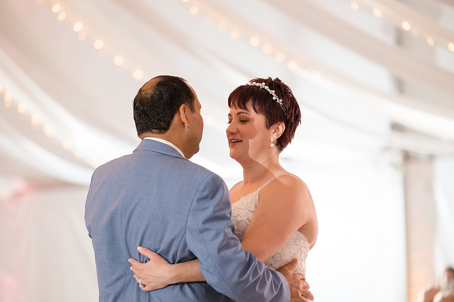 couple first dance under tent