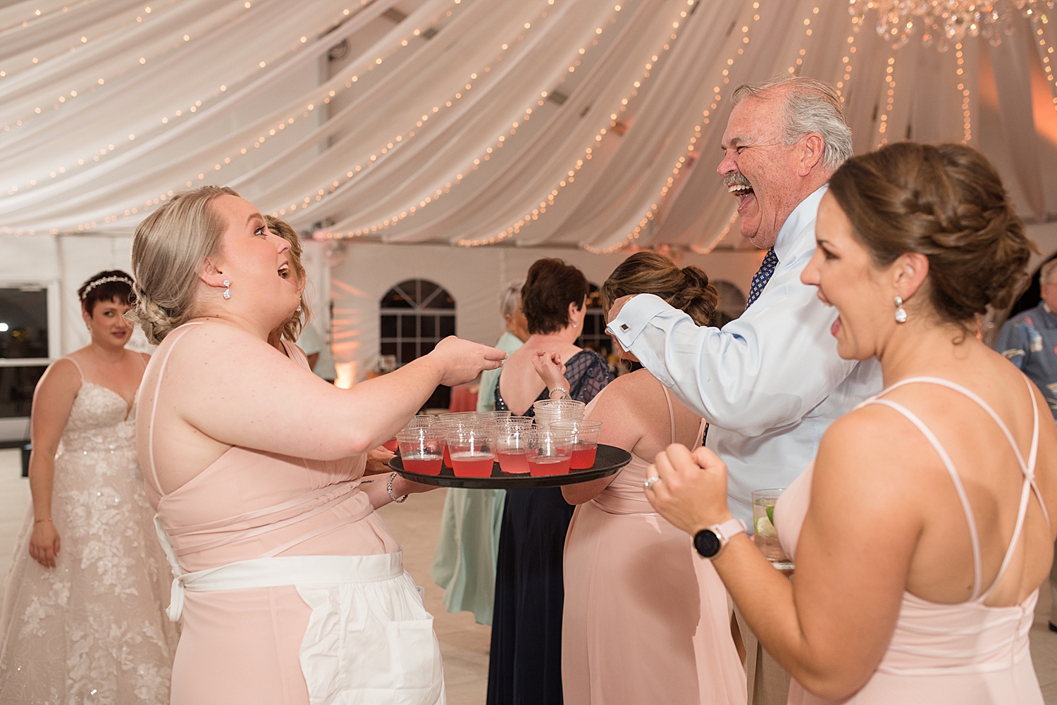 candid guests dancing with shots