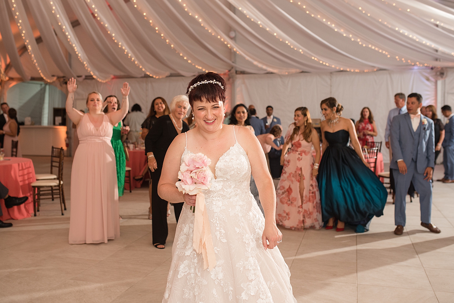 bride throwing bouquet