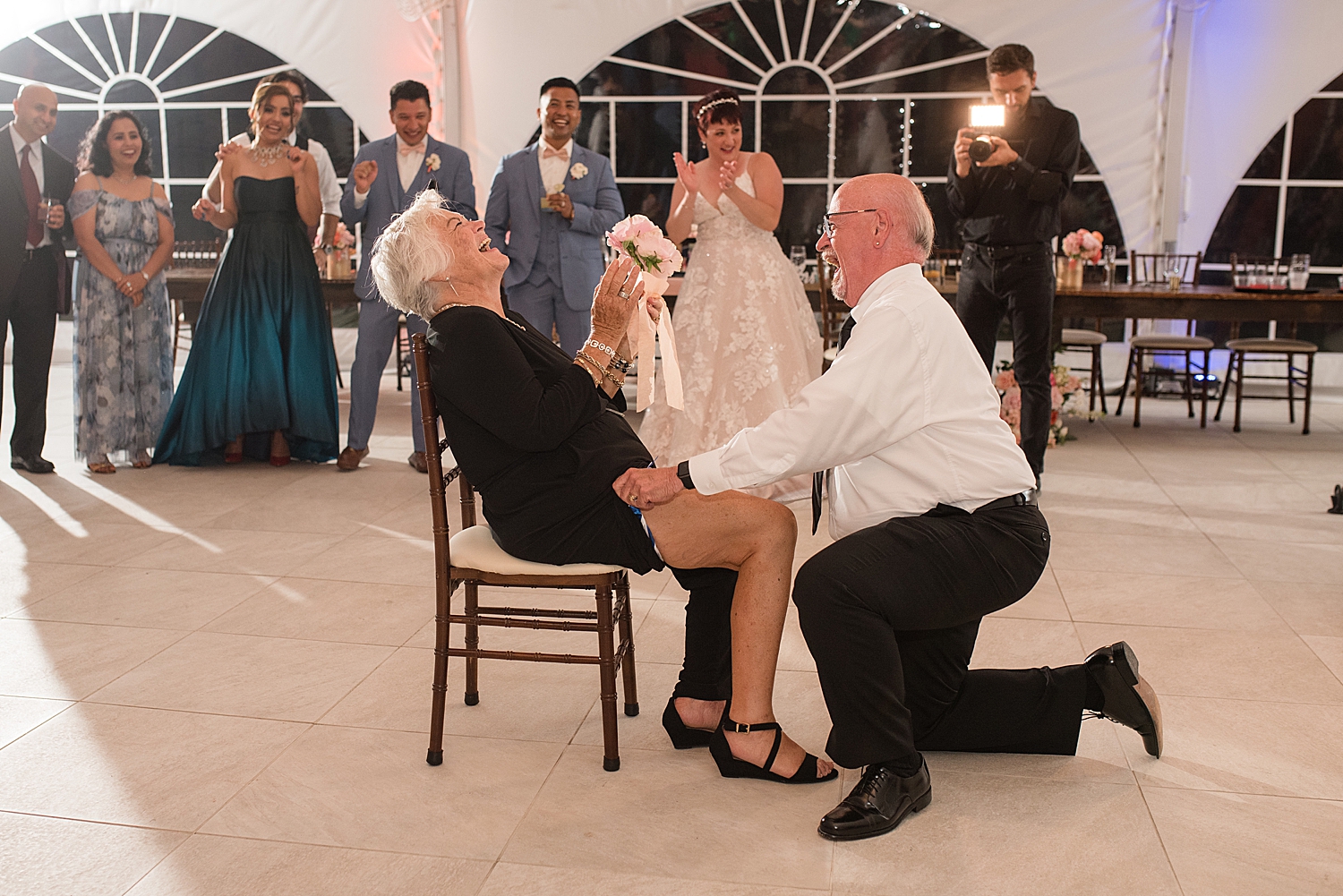 older couple puts garter on