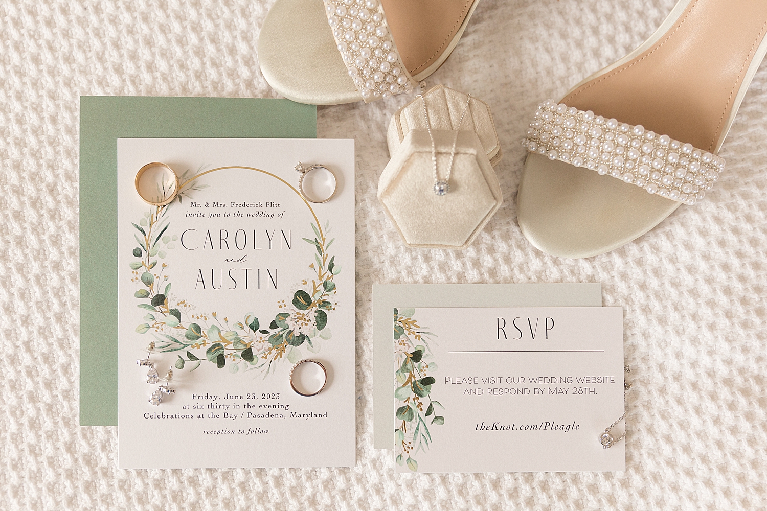 wedding flat lay, sage invitation and white details