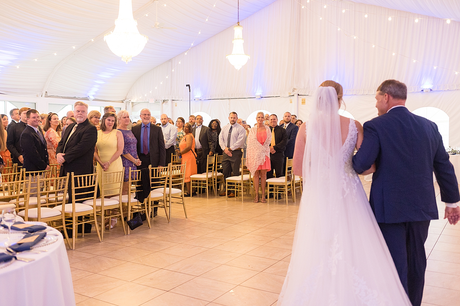 bride enters ceremony with dad