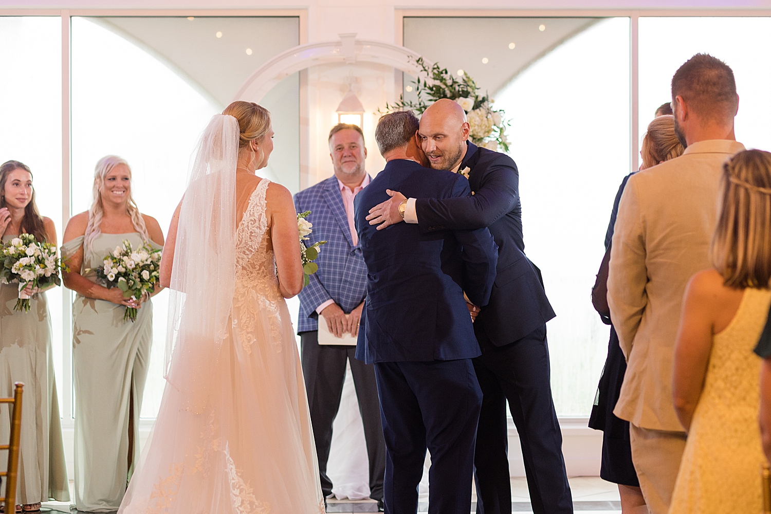 groom hugs father in law