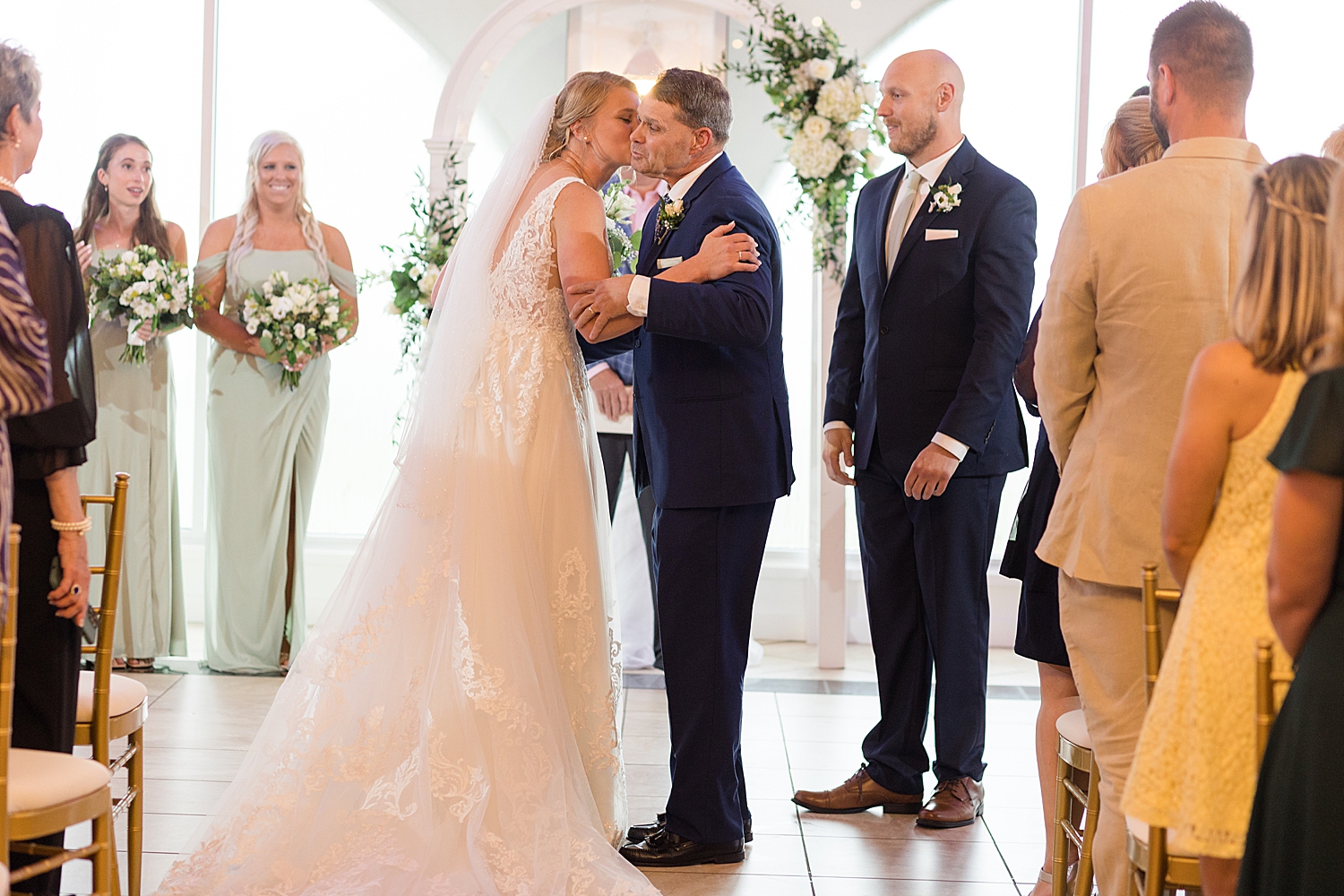 bride kisses dad on cheek