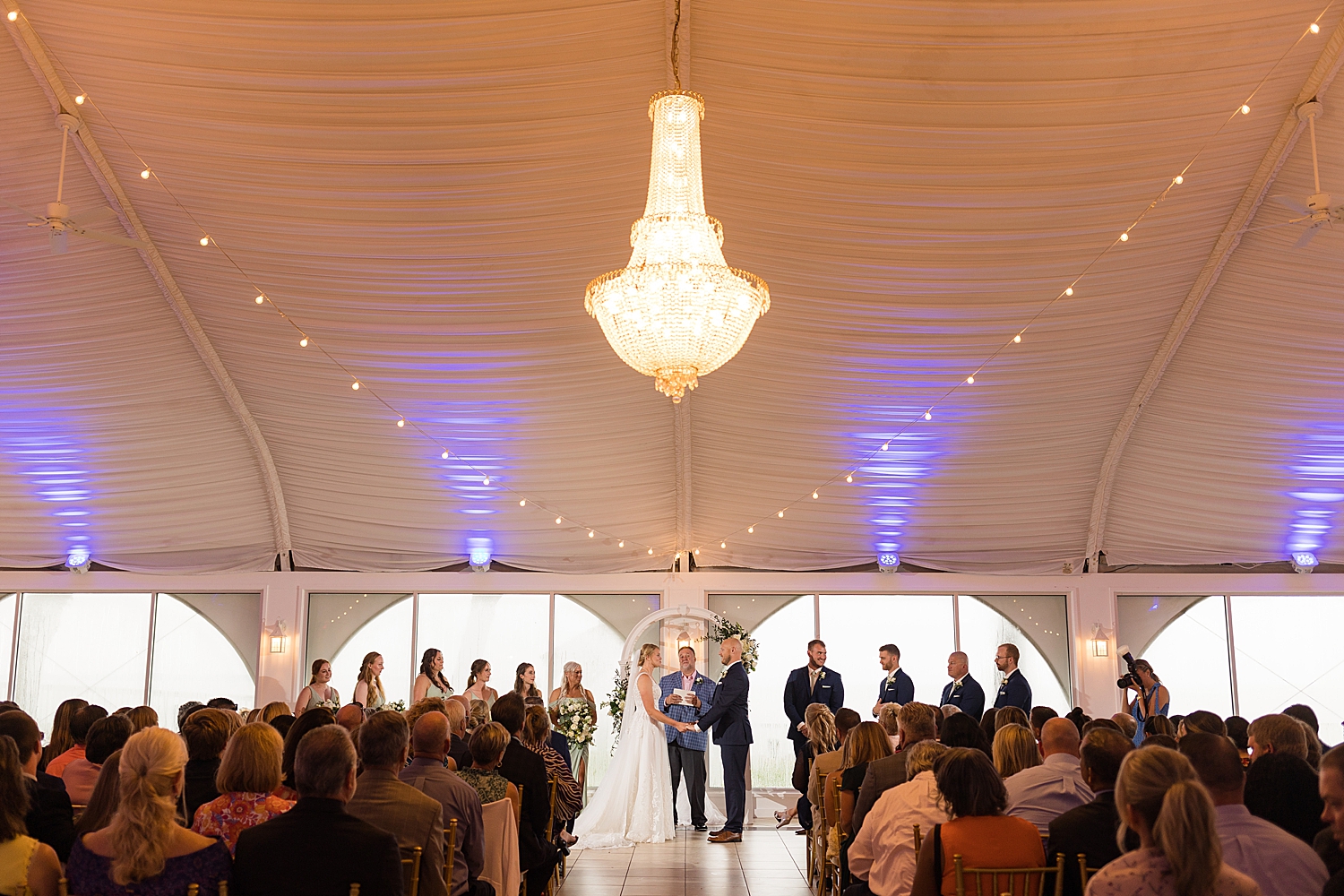 wide ceremony shot under tent