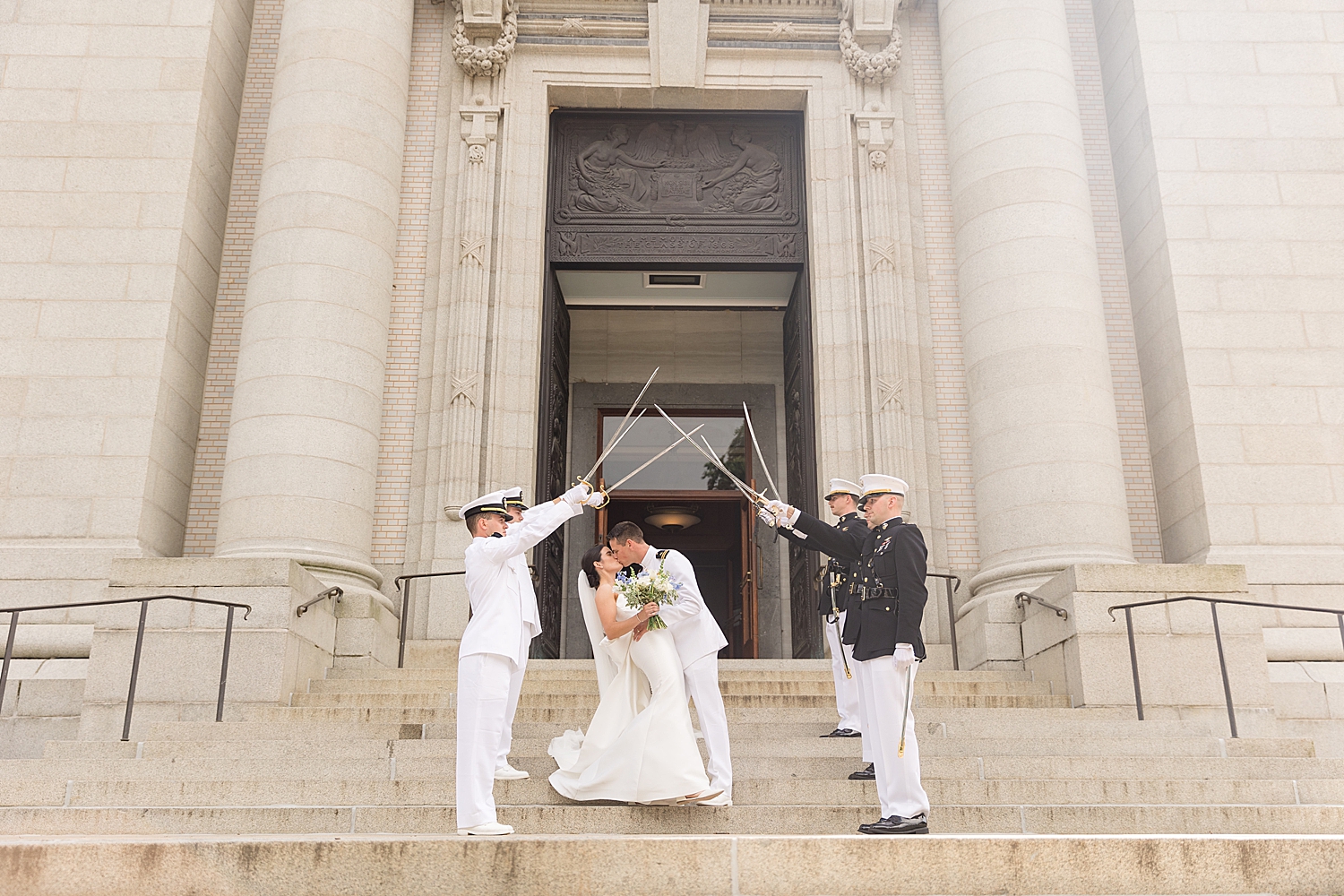 bride and groom leaving ceremony sword arch