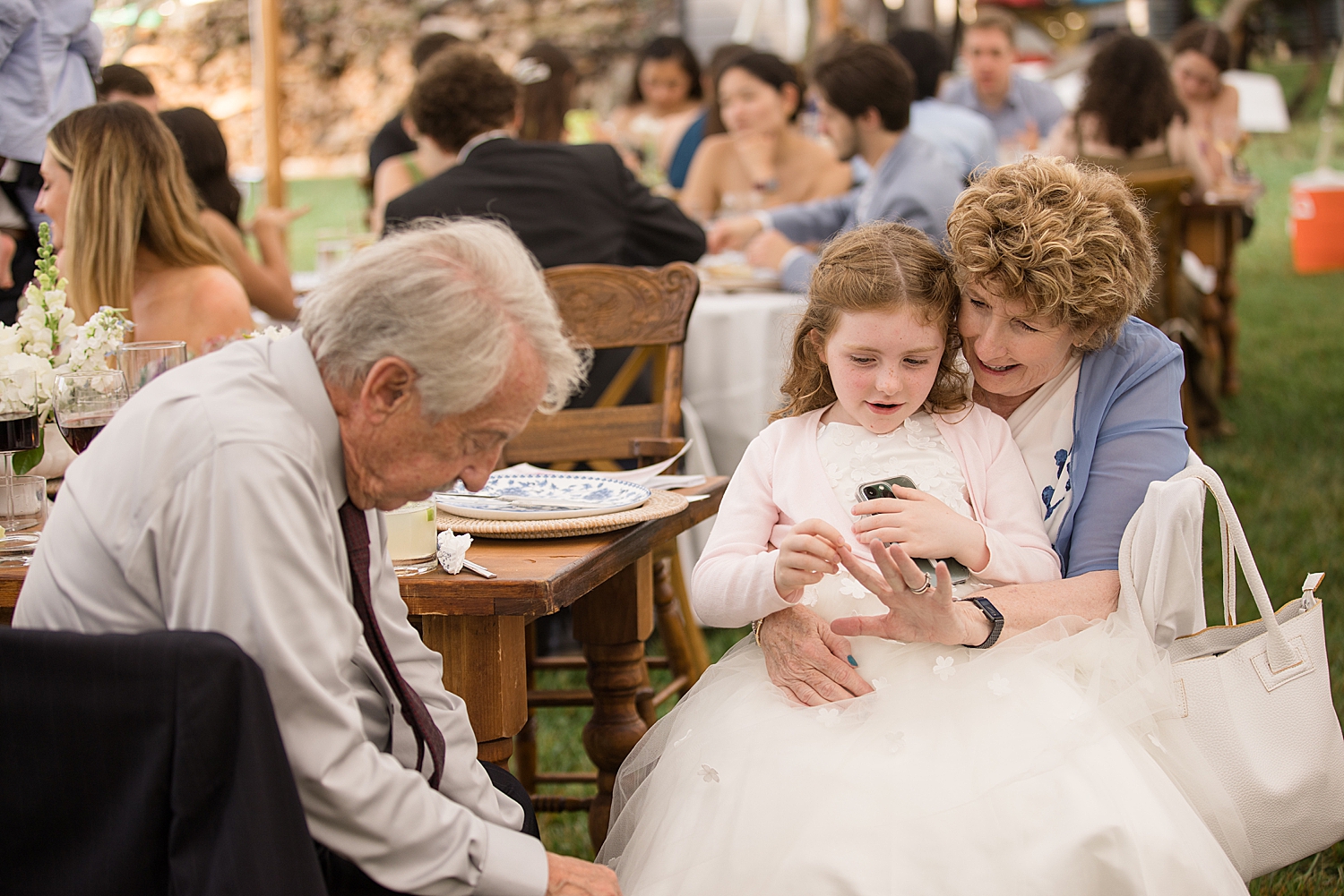 grandparents helping flower girl