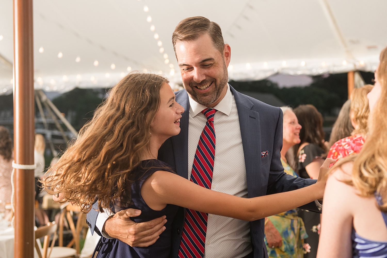 candid wedding guests dancing