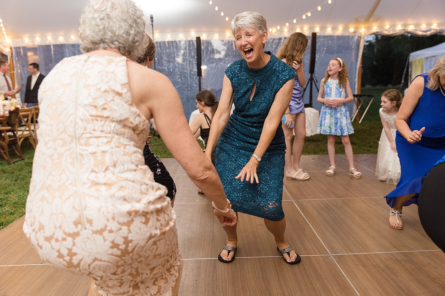 candid wedding guests dancing