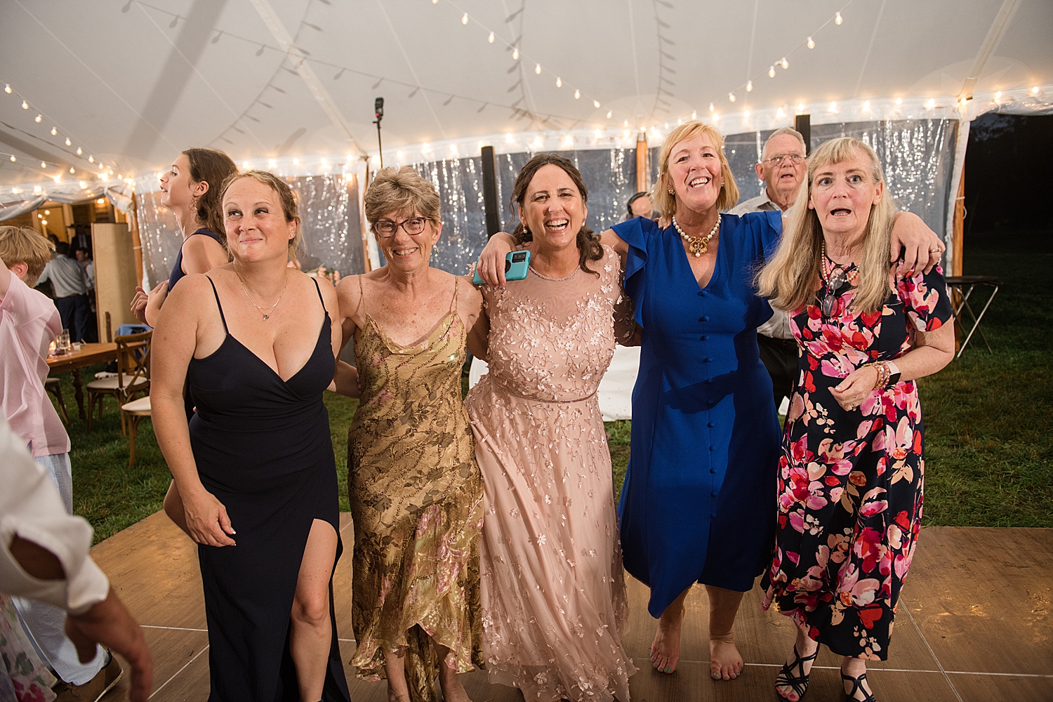 candid wedding guests dancing