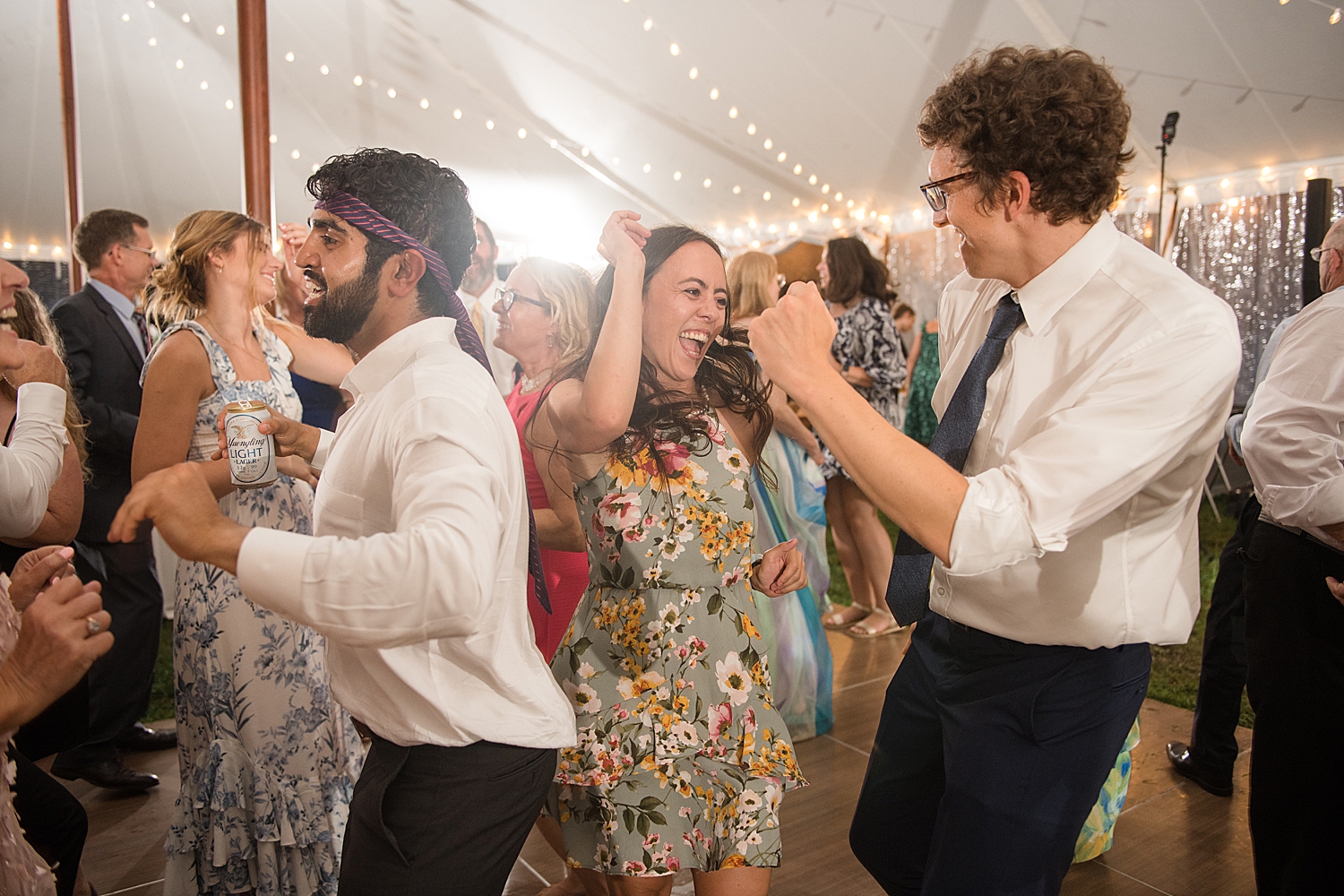 candid wedding guests dancing