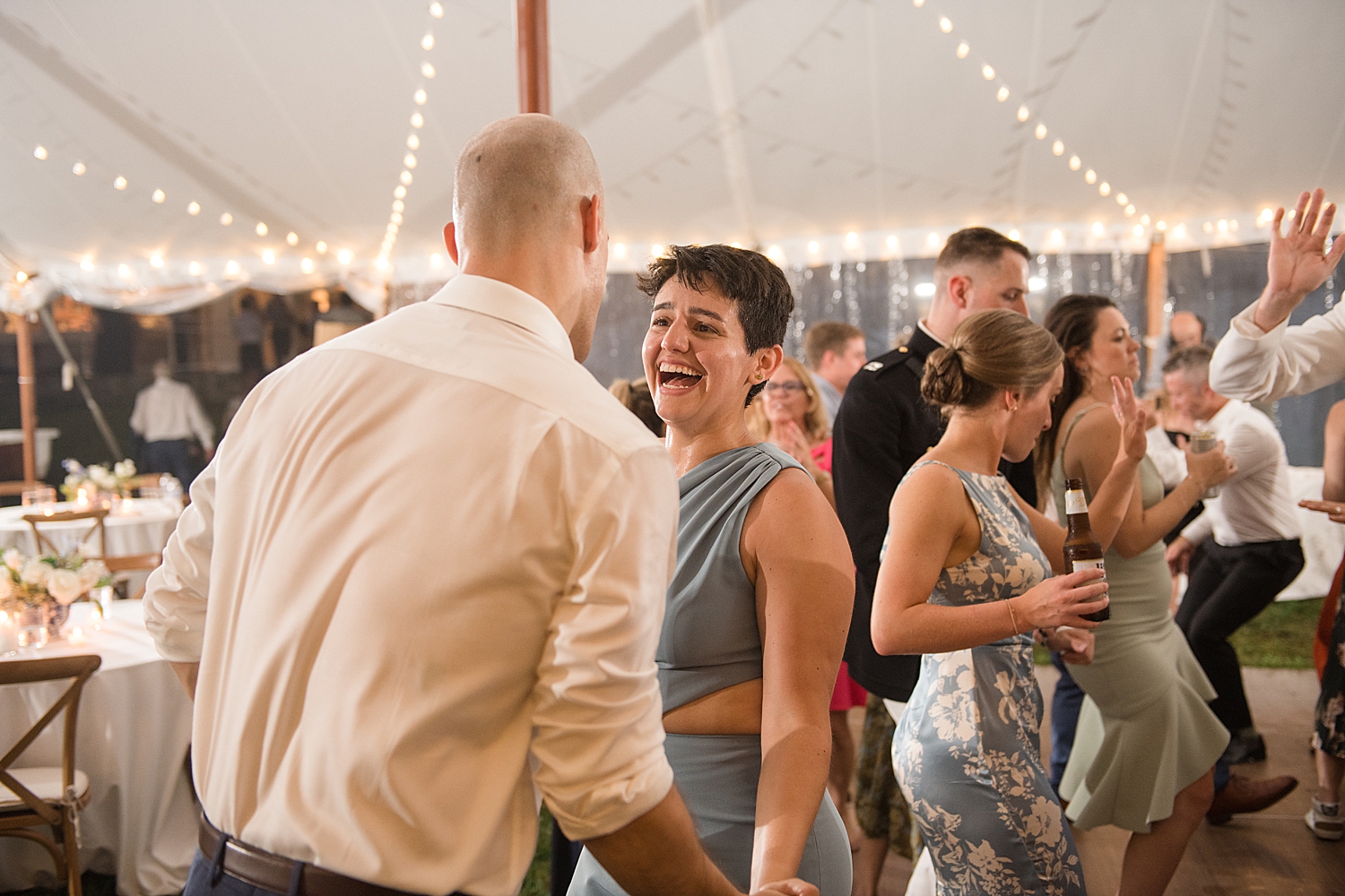 candid wedding guests dancing