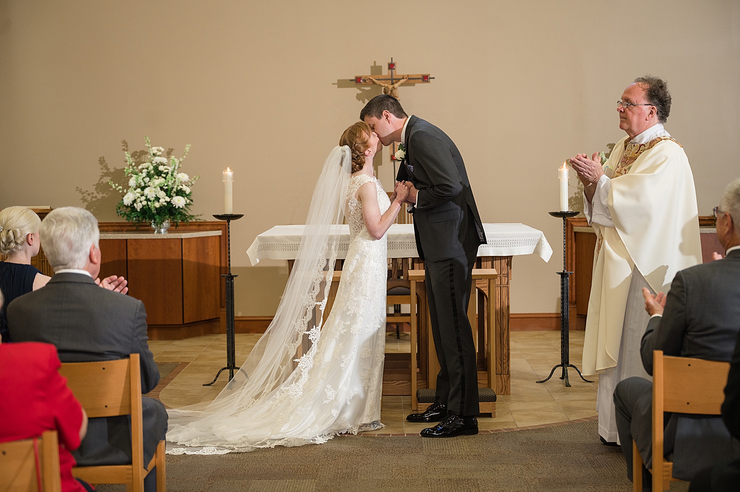 bride and groom first kiss