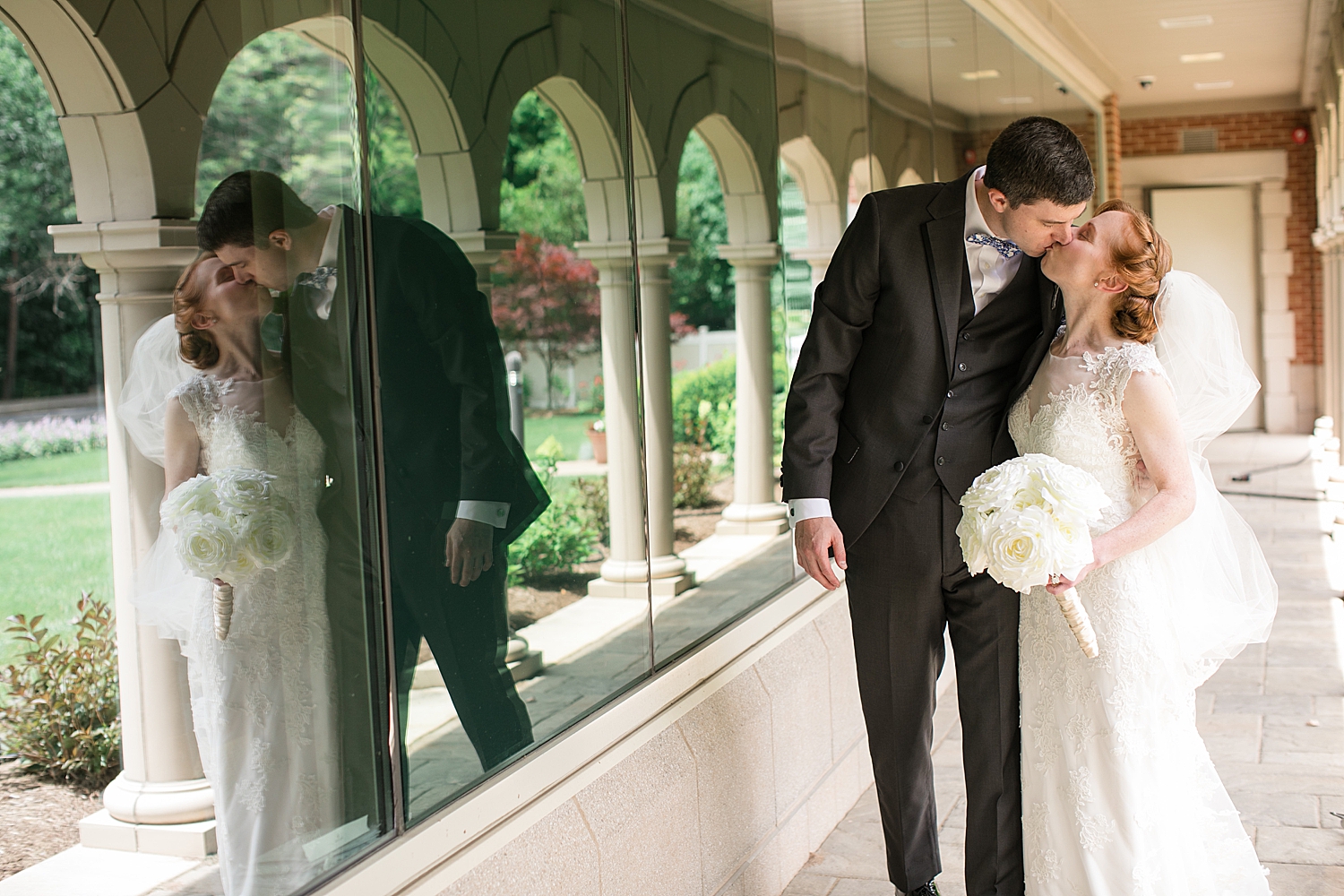 bride and groom kiss in church