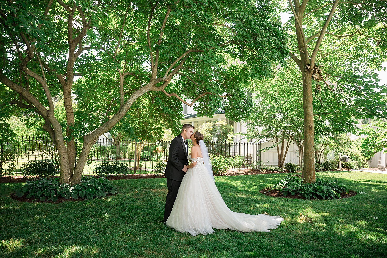 bride and groom first look under green trees