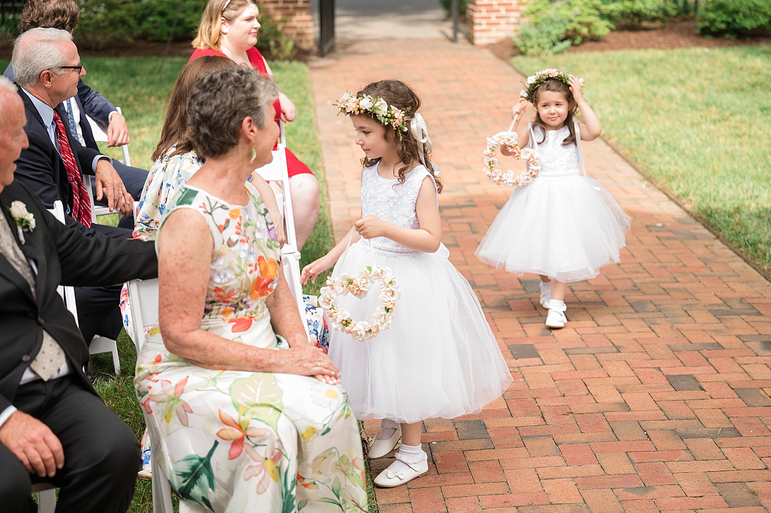 flower girls come down the aisle