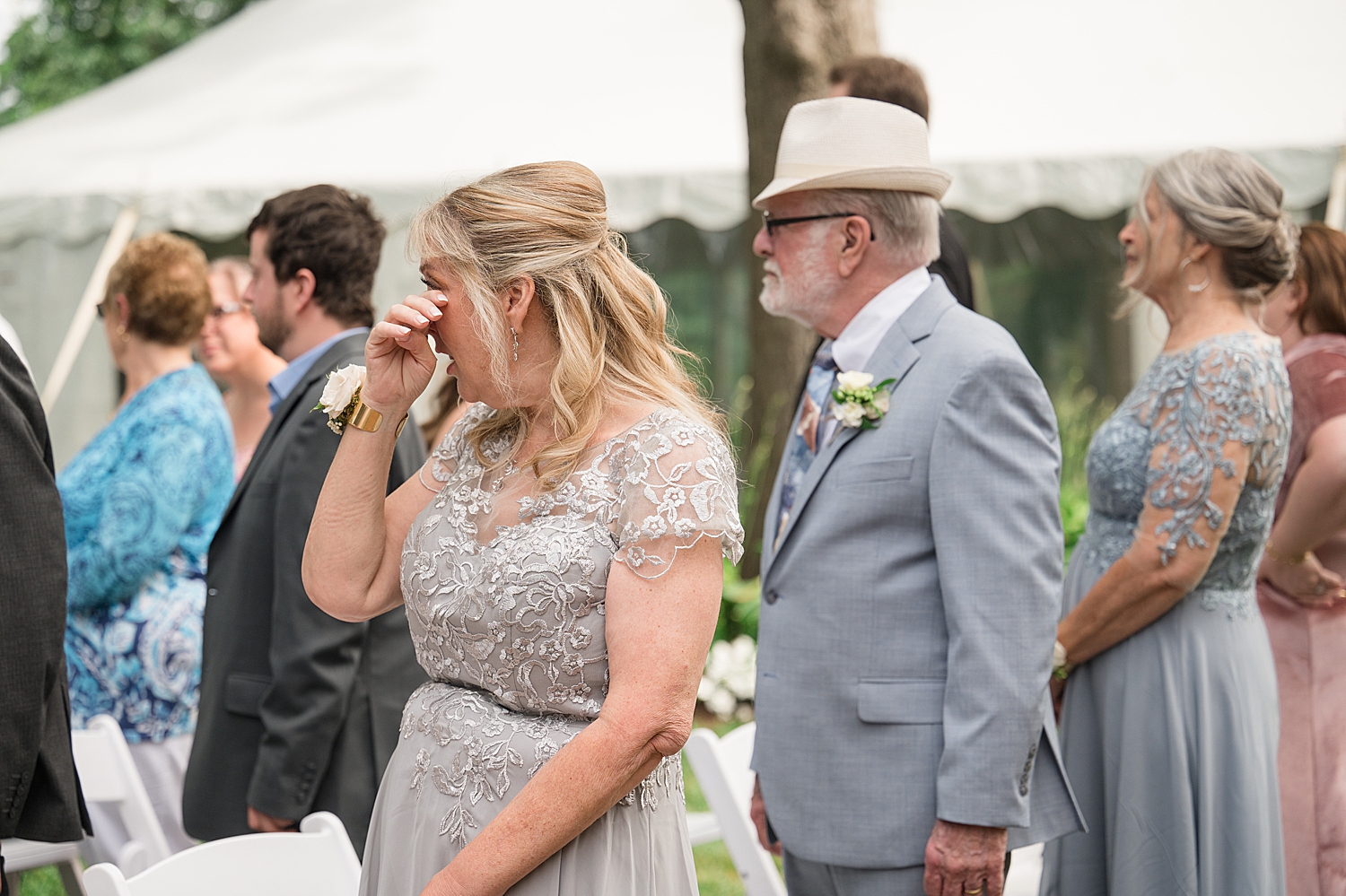 guests wiping away tears during wedding ceremony