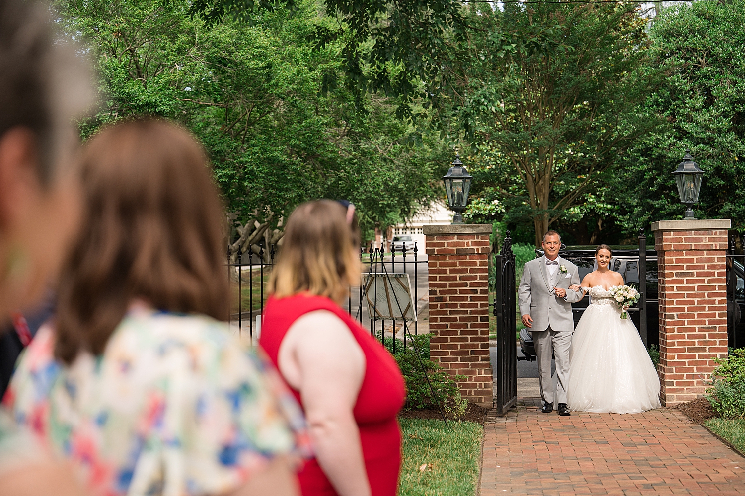 bride walks down the aisle with her dad