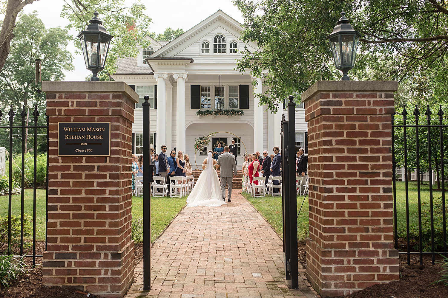 bride walks down the aisle with her dad