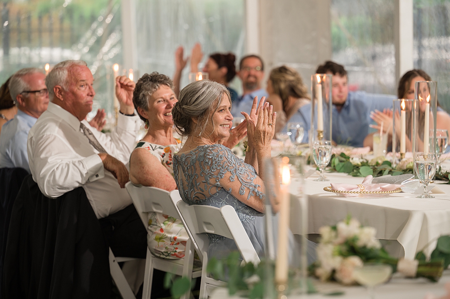 guests applaud after bride dances with dad