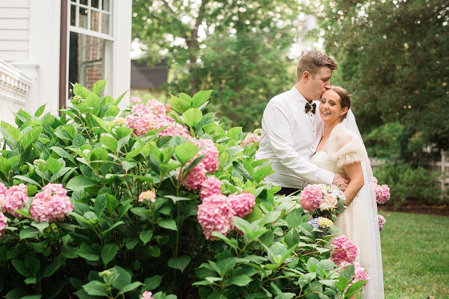 bride and groom portrait blooming flowers