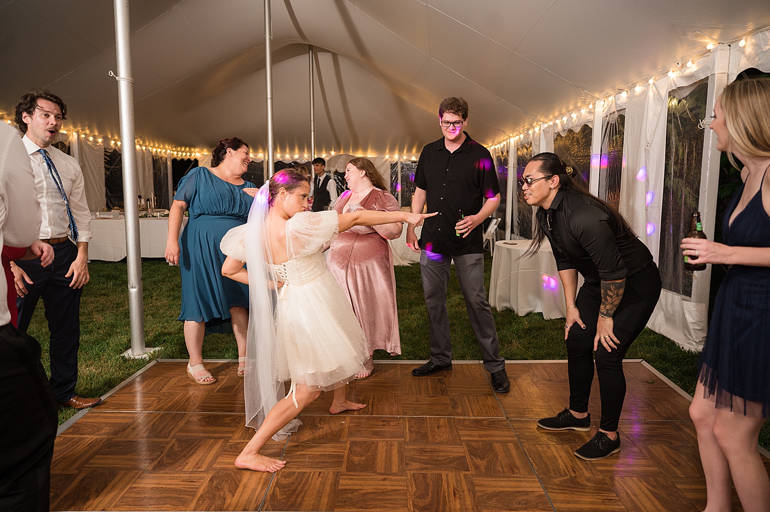 candid guests dancing bride