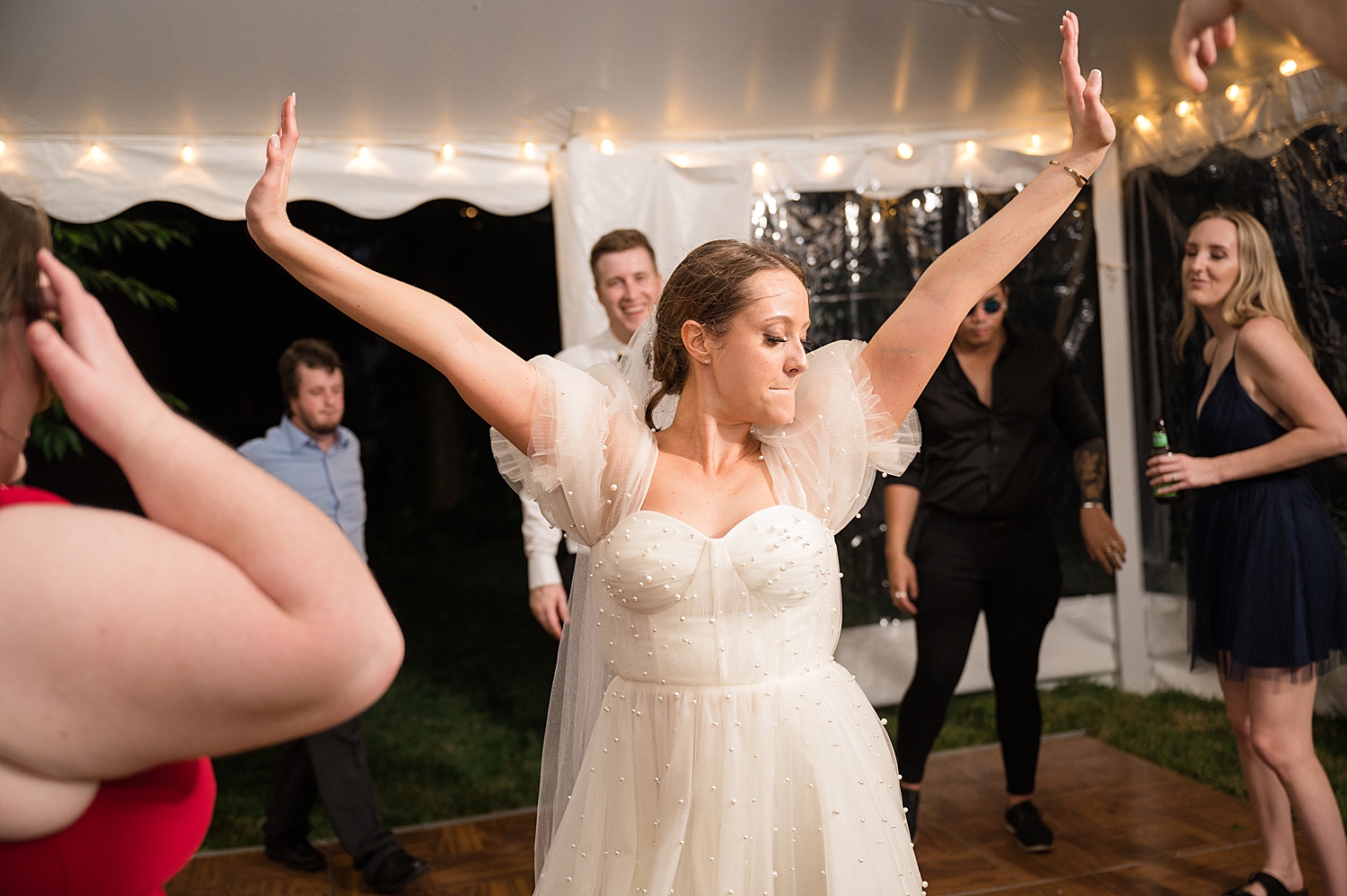 candid guests dancing bride